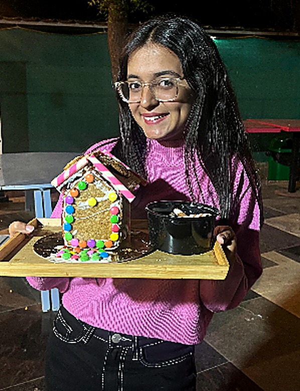 Gingerbread house decorating workshop participant