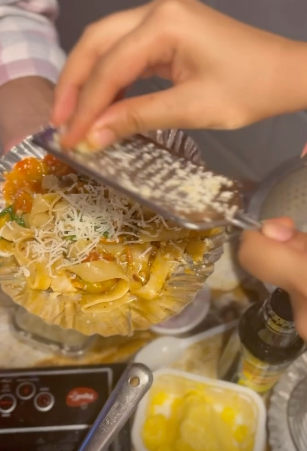 Fresh pasta workshop with parmesan being grated